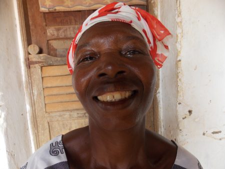 A woman, smiling at the camera