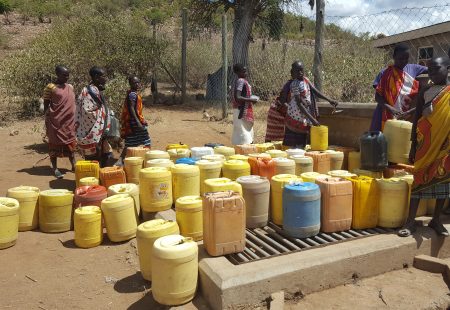: I also had the opportunity to go on a monitoring visit to two of our water projects in Kenya’s Maasai Mara district. This borehole was established in a community called Olooriri and, as you can see, it’s in high demand. While their livestock drink from a tough a short distance away from the borehole, women and children form a queue by lining up their water jugs. 