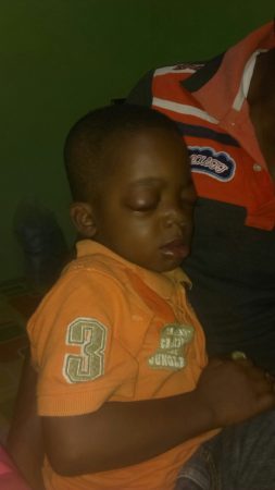 Young boy from Ghana has life-saving treatment by Operation Eyesight trained nurse.