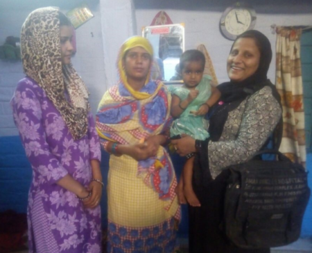 Indian community health worker trained by Operation Eyesight helps young girl