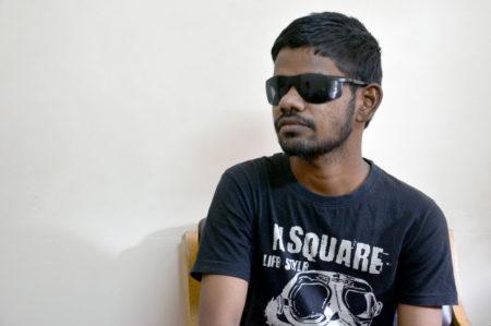 Young Indian man recovering after his corneal transplant. 