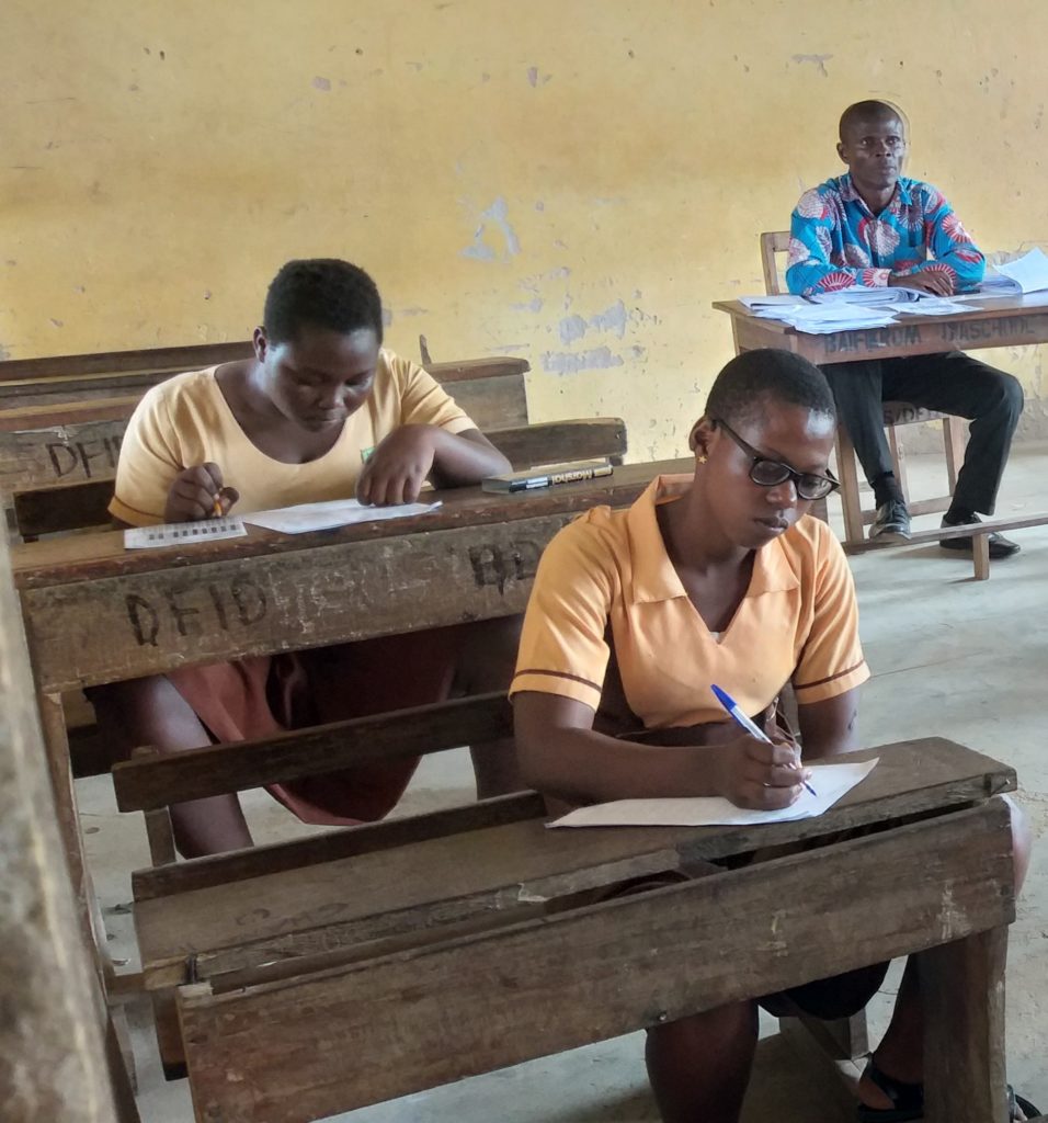 Jennifer sitting in her class, writing an exam