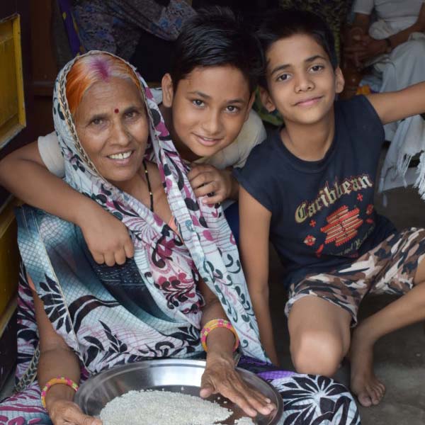 Photo of a woman sitting with two young boys