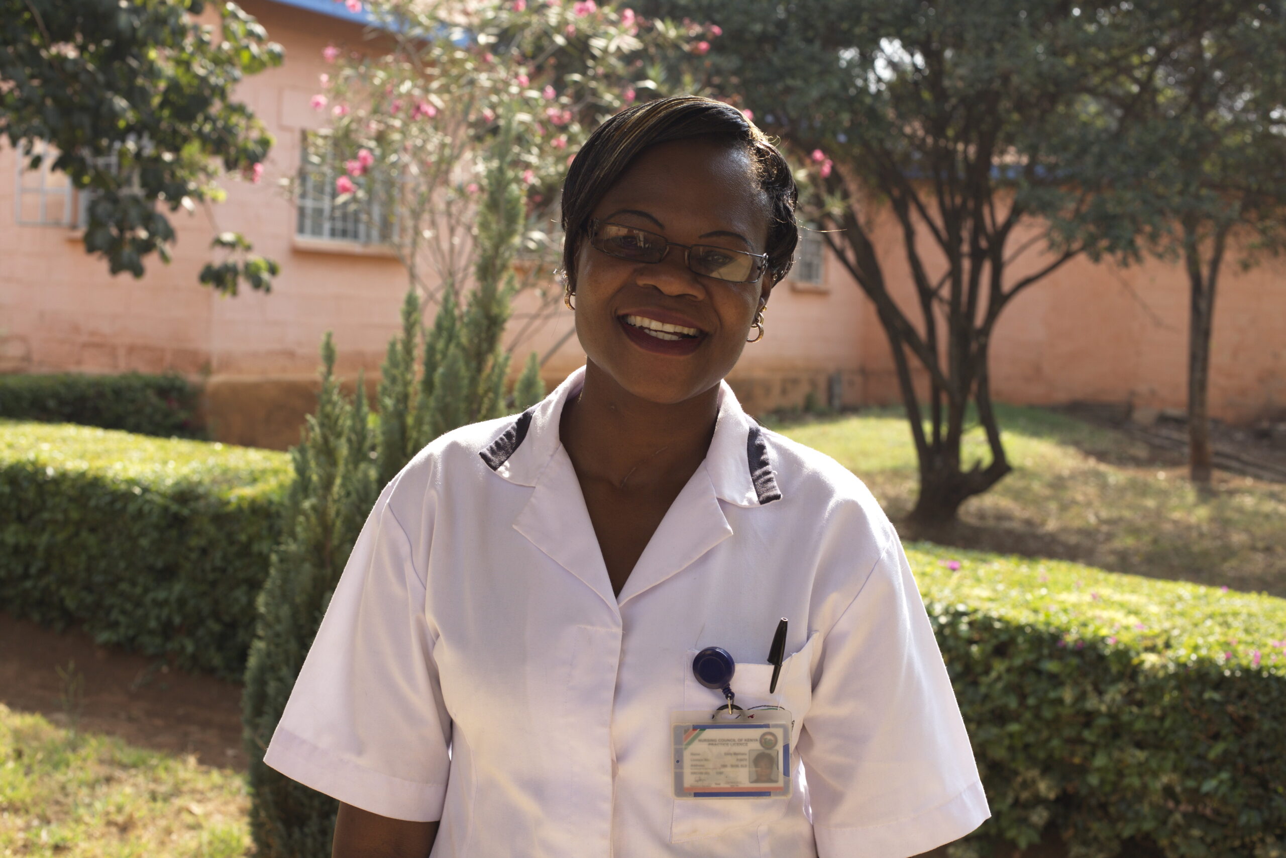 A healthcare professional, smiling at the camera