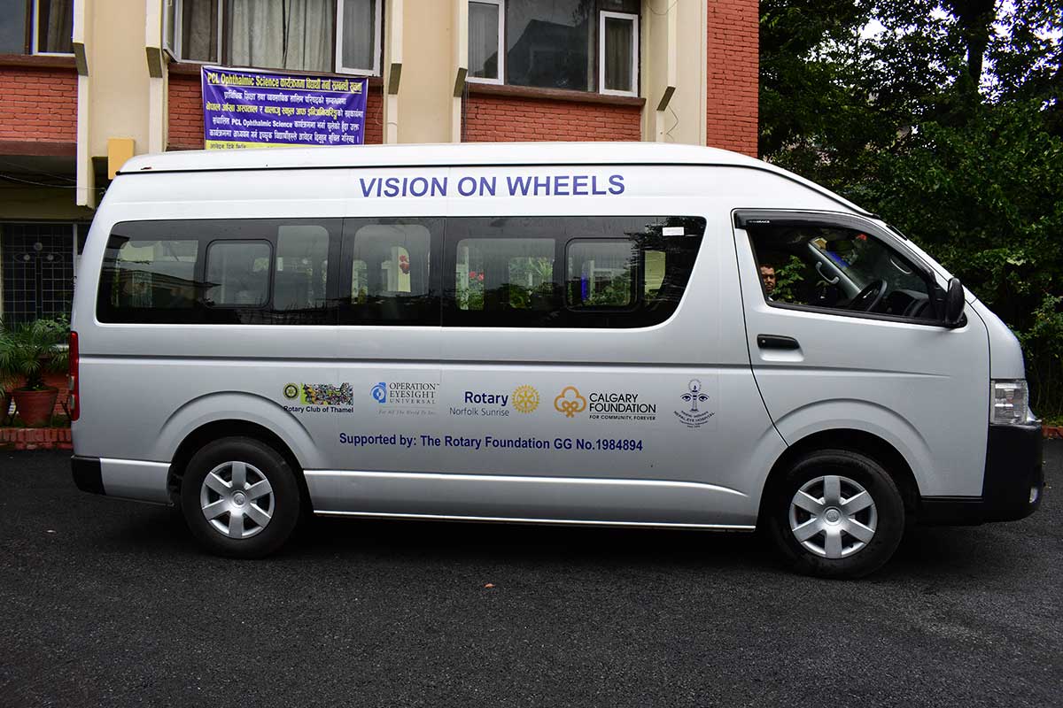 A van with the text Vision on Wheels on top